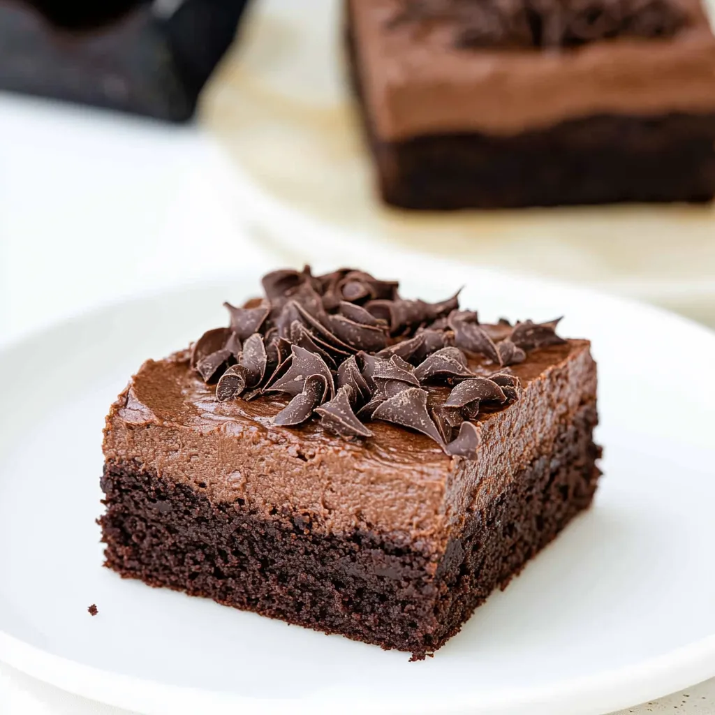 A slice of chocolate cake with chocolate chips.