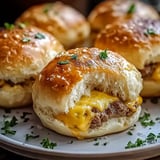 A plate of sandwiches with cheese and meat.