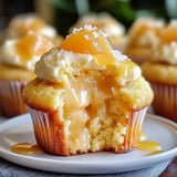 A cupcake with a bite taken out of it.
