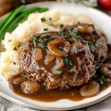 Classic Salisbury steak with a rich gravy, perfect for a comforting, old-fashioned meal.