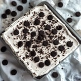 Creamy no-bake cookies and cream mousse cake with layers of rich chocolate and Oreo goodness.