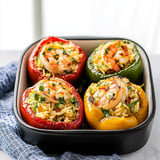 Colorful peppers stuffed with shrimp, rice, and savory spices for a hearty and flavorful dish.