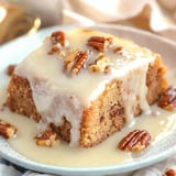 Moist Southern pecan praline cake drizzled with rich, buttery sauce for a decadent dessert.