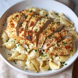 Crispy parmesan garlic chicken served with creamy garlic Alfredo shells.