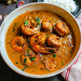 Rich and creamy Chingri Malaikari with tender prawns in a spiced coconut milk gravy.