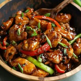 Tender chicken in a rich, savory Chinese garlic sauce with stir-fried veggies.