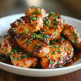 Tender sticky Asian glazed chicken coated in a sweet and savory sauce.