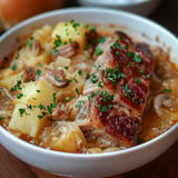 Traditional Polish kwaśnica, a hearty sauerkraut soup with smoked meat and bold flavors.